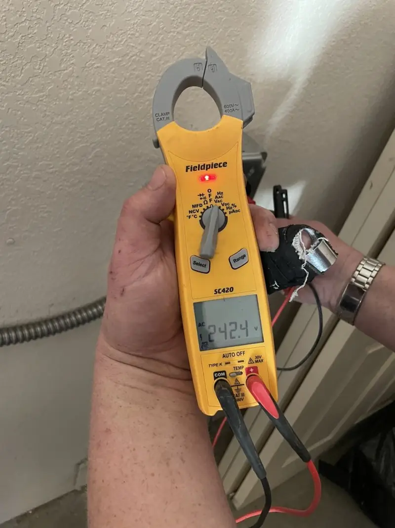 Voltage testing with clamp meter during Generator Installation in Whiting